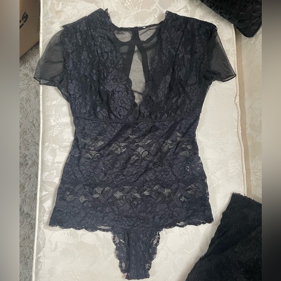Lacey black short sleeve body suit with mesh deep V. It has four buttons in back - Picture 1 of 4